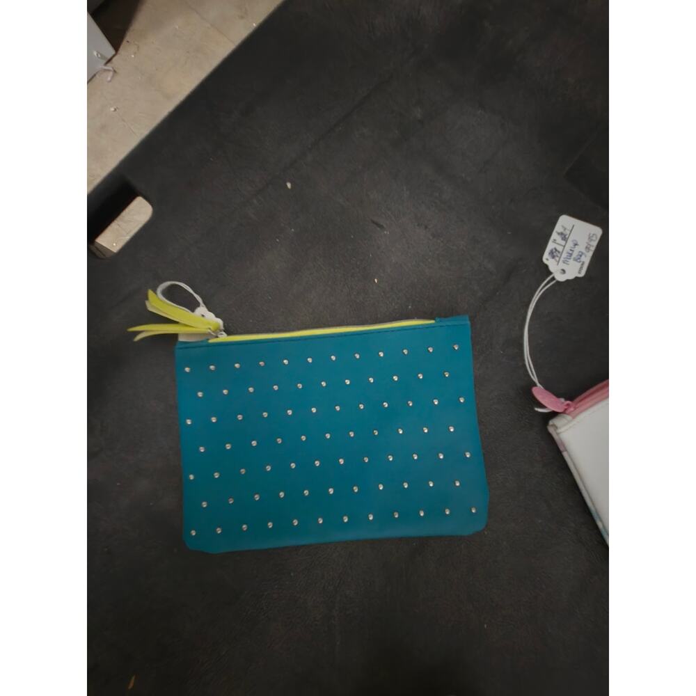 IPSY March 2020 100th Glam Bag, featuring a teal faux-leather exterior